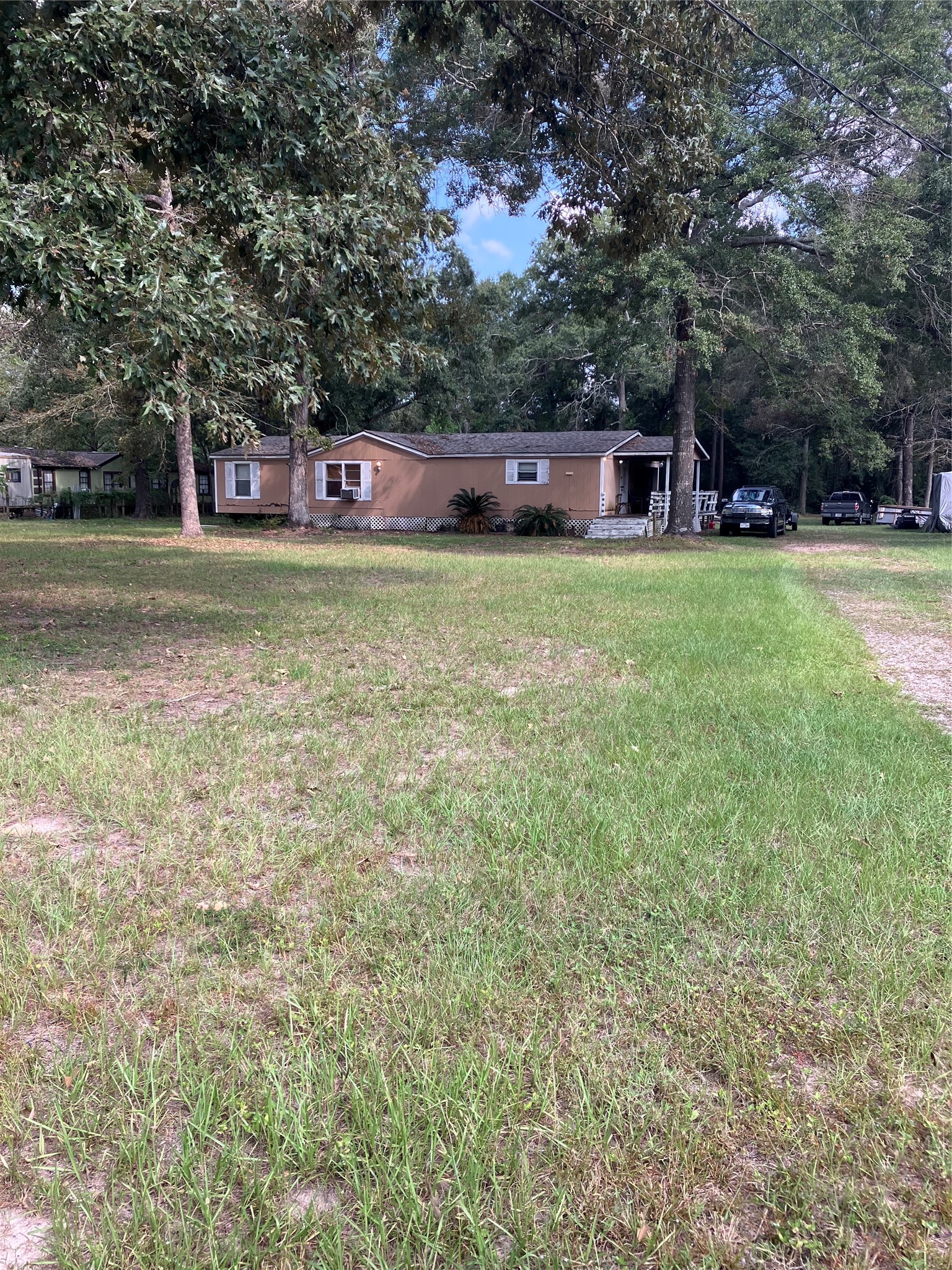 20923 Stevens Street New Caney, TX 77357 - Photo 2 of 20 a view of a house with a yard