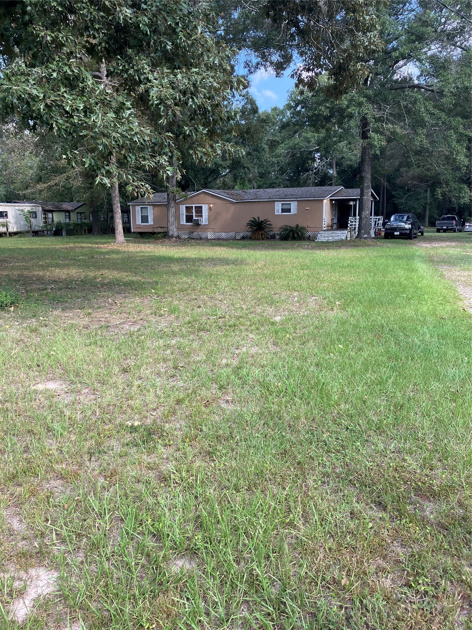 20923 Stevens Street New Caney, TX 77357 - Photo 3 of 20 a view of a house with a big yard
