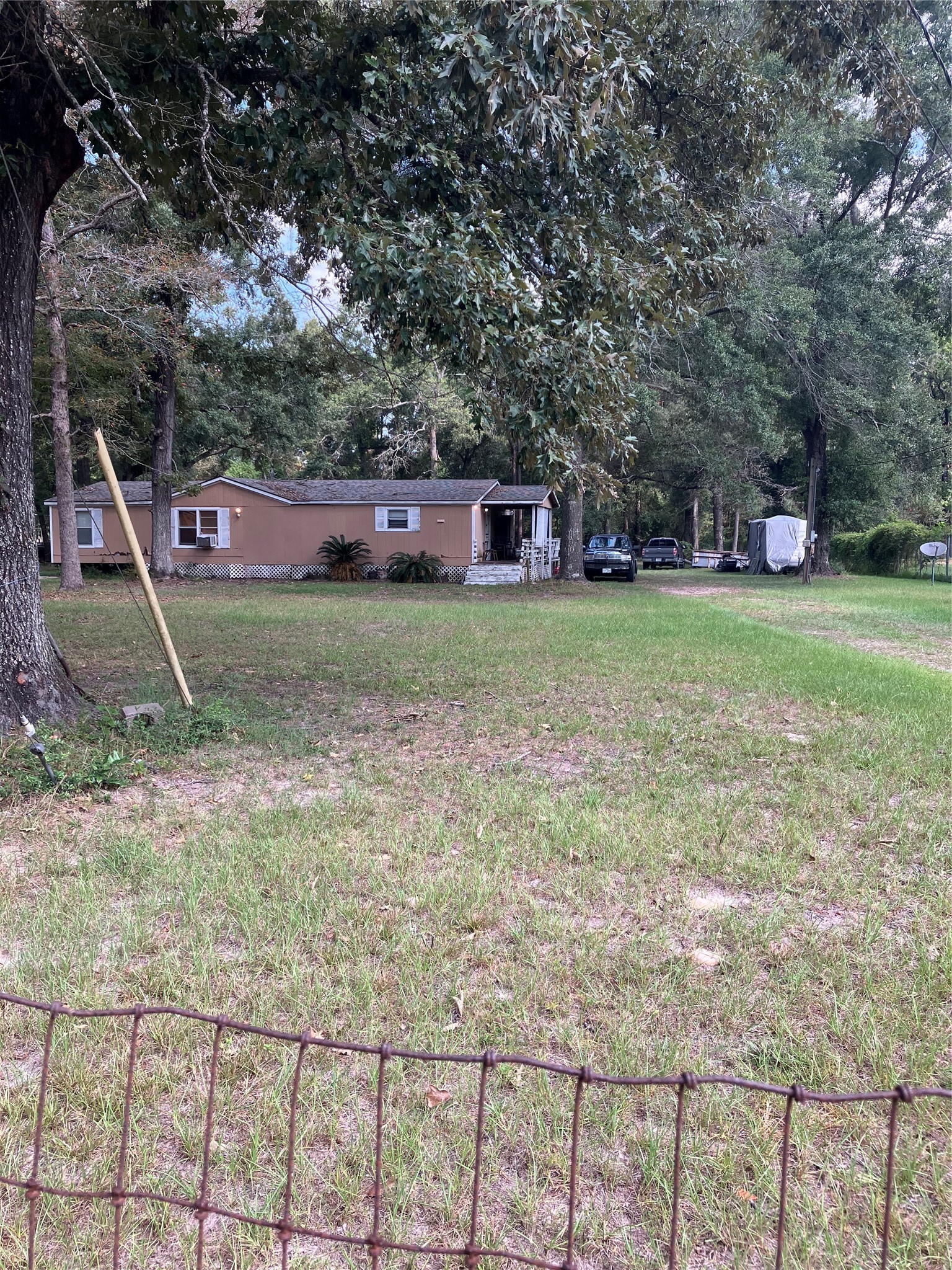20923 Stevens Street New Caney, TX 77357 - Photo 4 of 20 a front view of a house with a yard