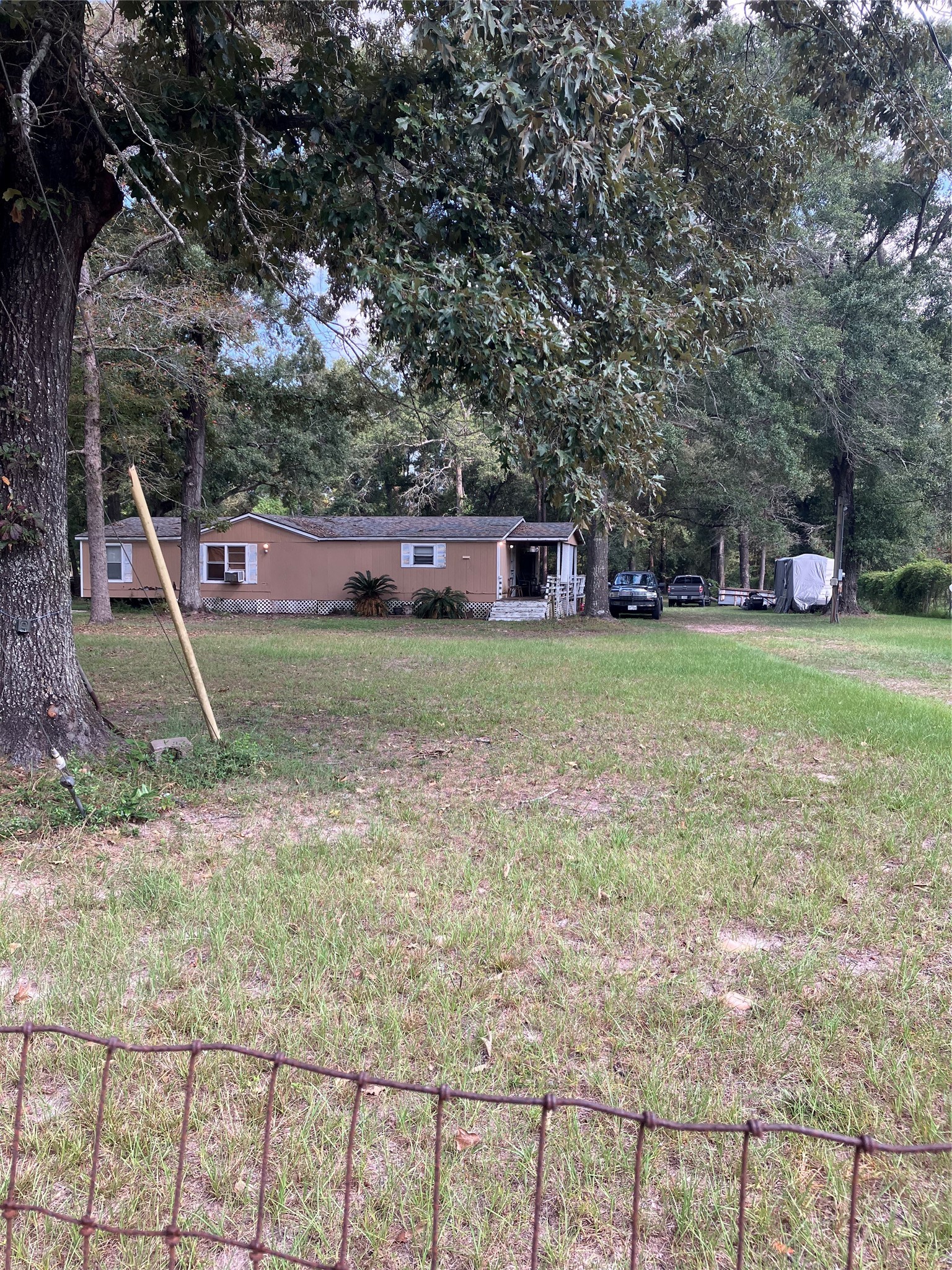 20923 Stevens Street New Caney, TX 77357 - Photo 5 of 20 a view of a house with a backyard