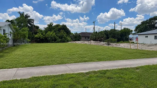 a view of a golf course with a house