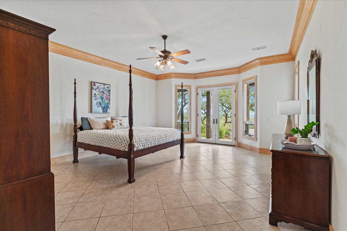 167 Wimberley Ranch Drive Wimberley, TX 78676 - Photo 14 of 40 a living room with furniture and a chandelier
