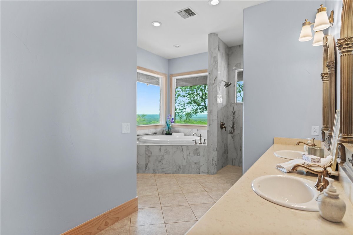 167 Wimberley Ranch Drive Wimberley, TX 78676 - Photo 15 of 40 a bathroom with a sink and a mirror