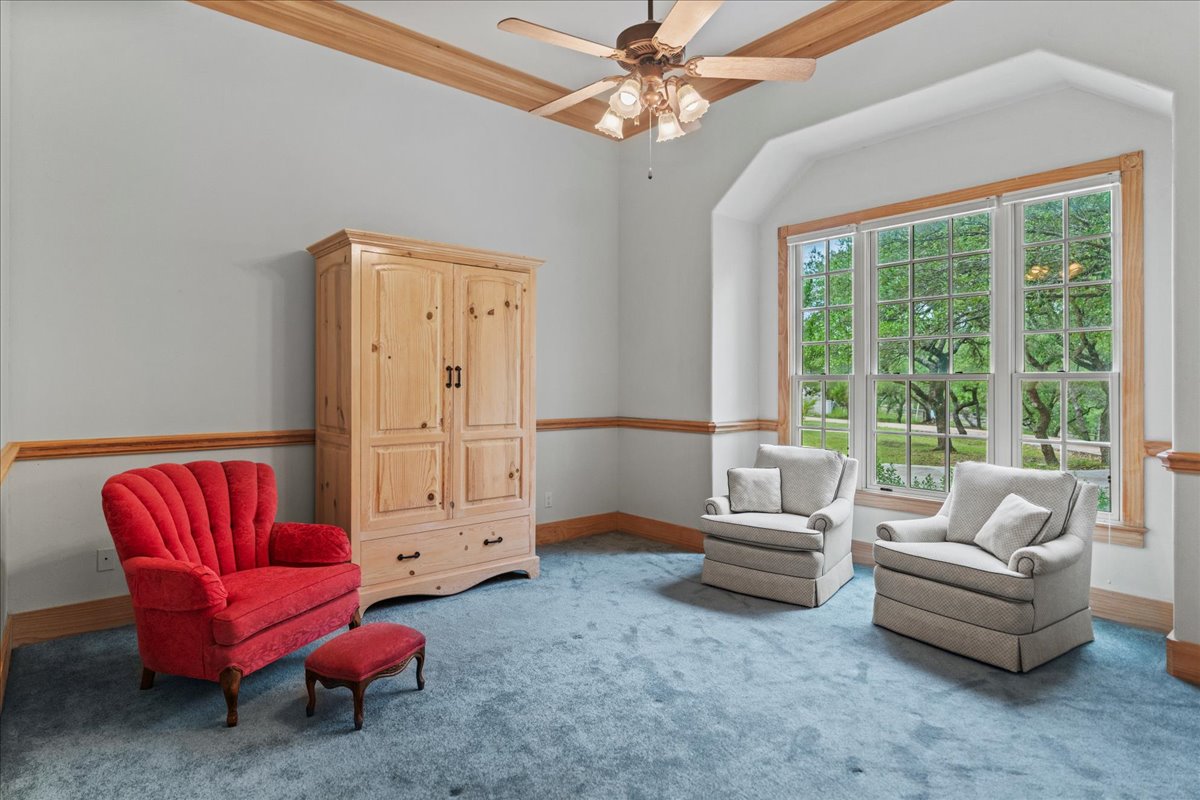 167 Wimberley Ranch Drive Wimberley, TX 78676 - Photo 19 of 40 a living room with furniture a ceiling fan and a window