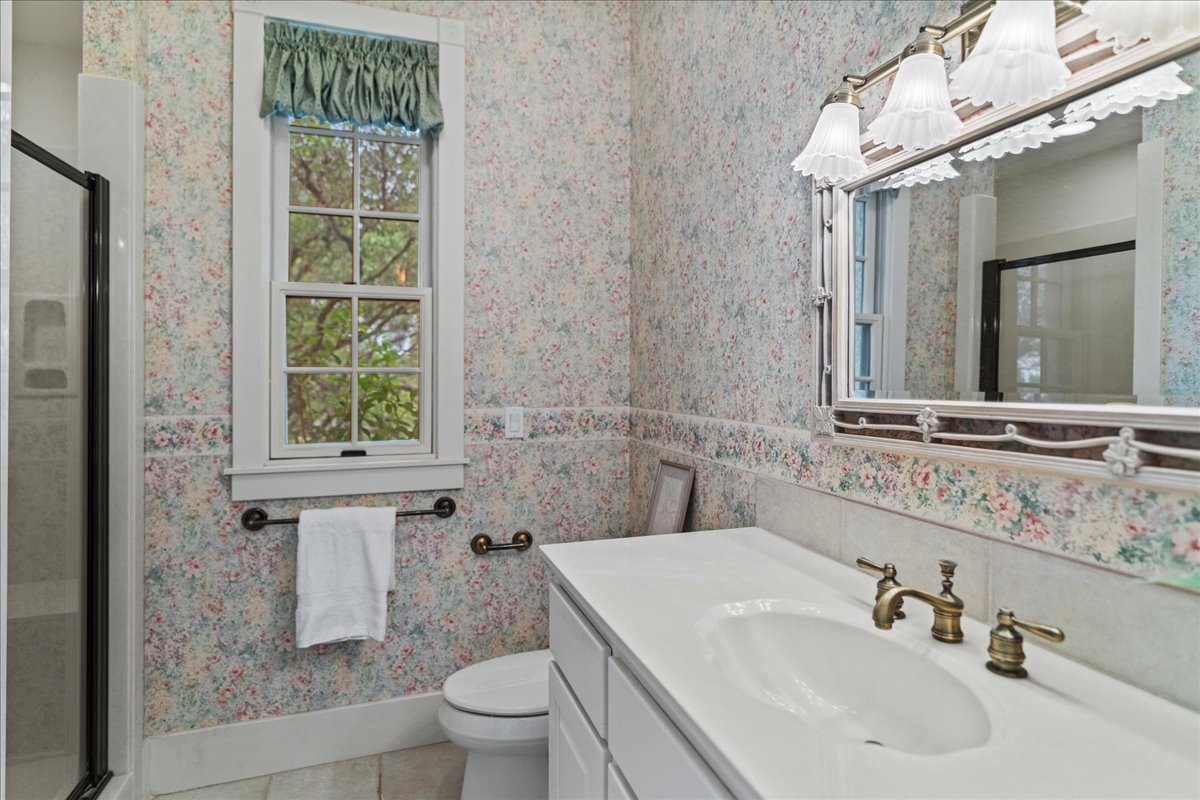 167 Wimberley Ranch Drive Wimberley, TX 78676 - Photo 22 of 40 a bathroom with a sink toilet and shower