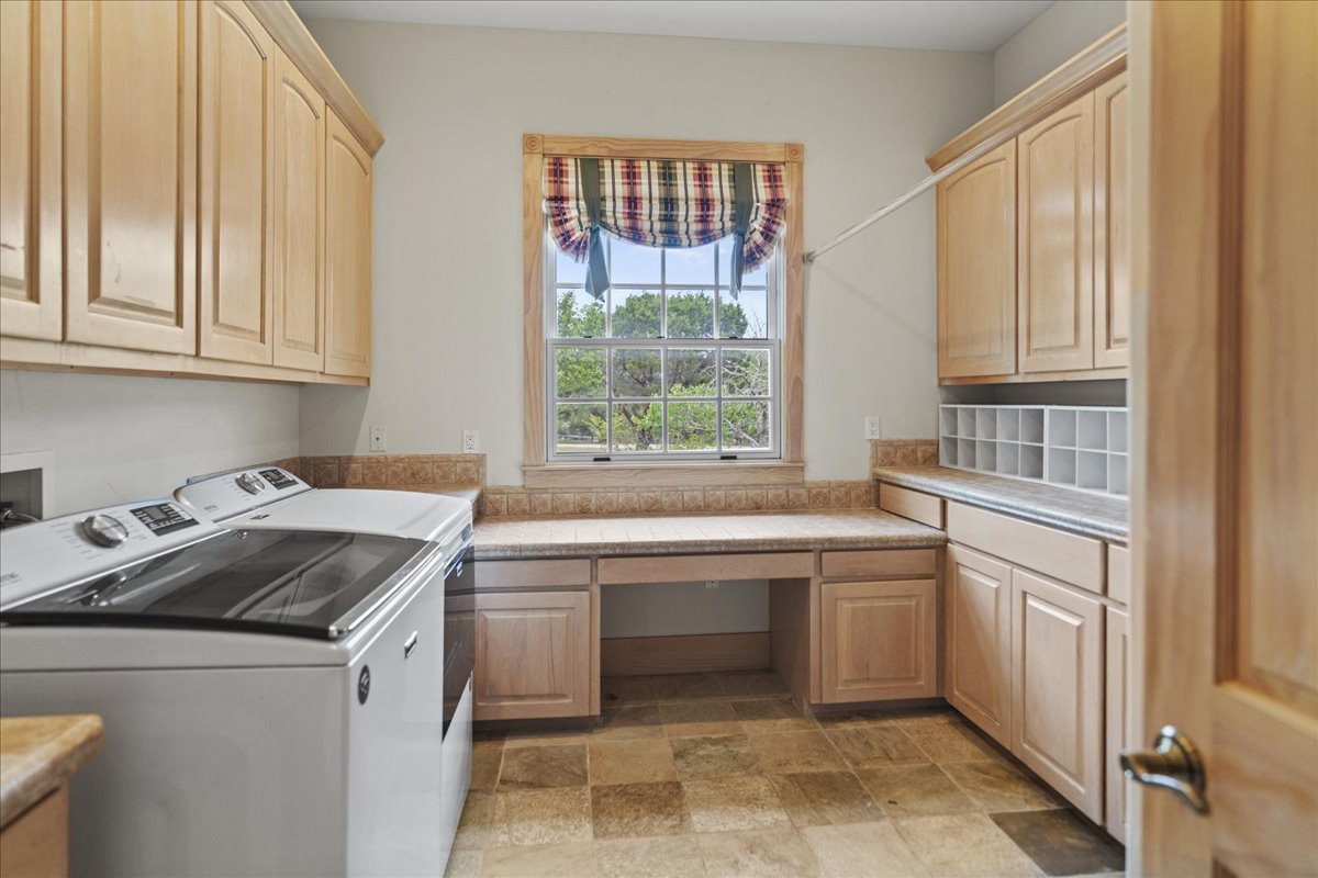 167 Wimberley Ranch Drive Wimberley, TX 78676 - Photo 26 of 40 a kitchen with a sink stove and cabinets