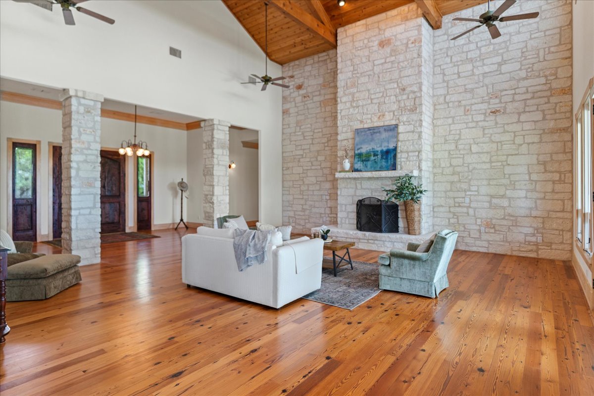 167 Wimberley Ranch Drive Wimberley, TX 78676 - Photo 27 of 40 a living room with furniture and a fireplace