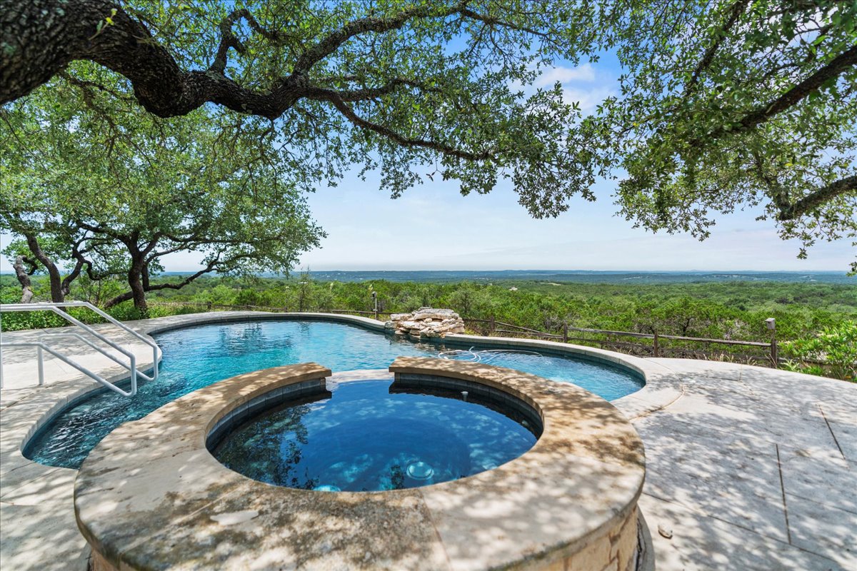 167 Wimberley Ranch Drive Wimberley, TX 78676 - Photo 3 of 40 a view of a swimming pool with a yard