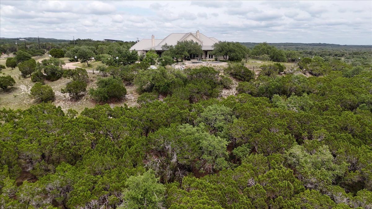 167 Wimberley Ranch Drive Wimberley, TX 78676 - Photo 37 of 40 an aerial view of a houses with outdoor space and trees