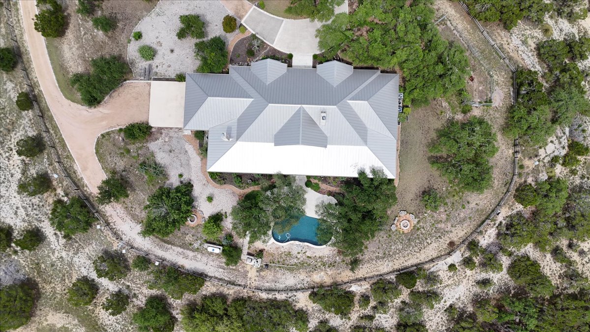 167 Wimberley Ranch Drive Wimberley, TX 78676 - Photo 39 of 40 an aerial view of a house with a yard and large trees
