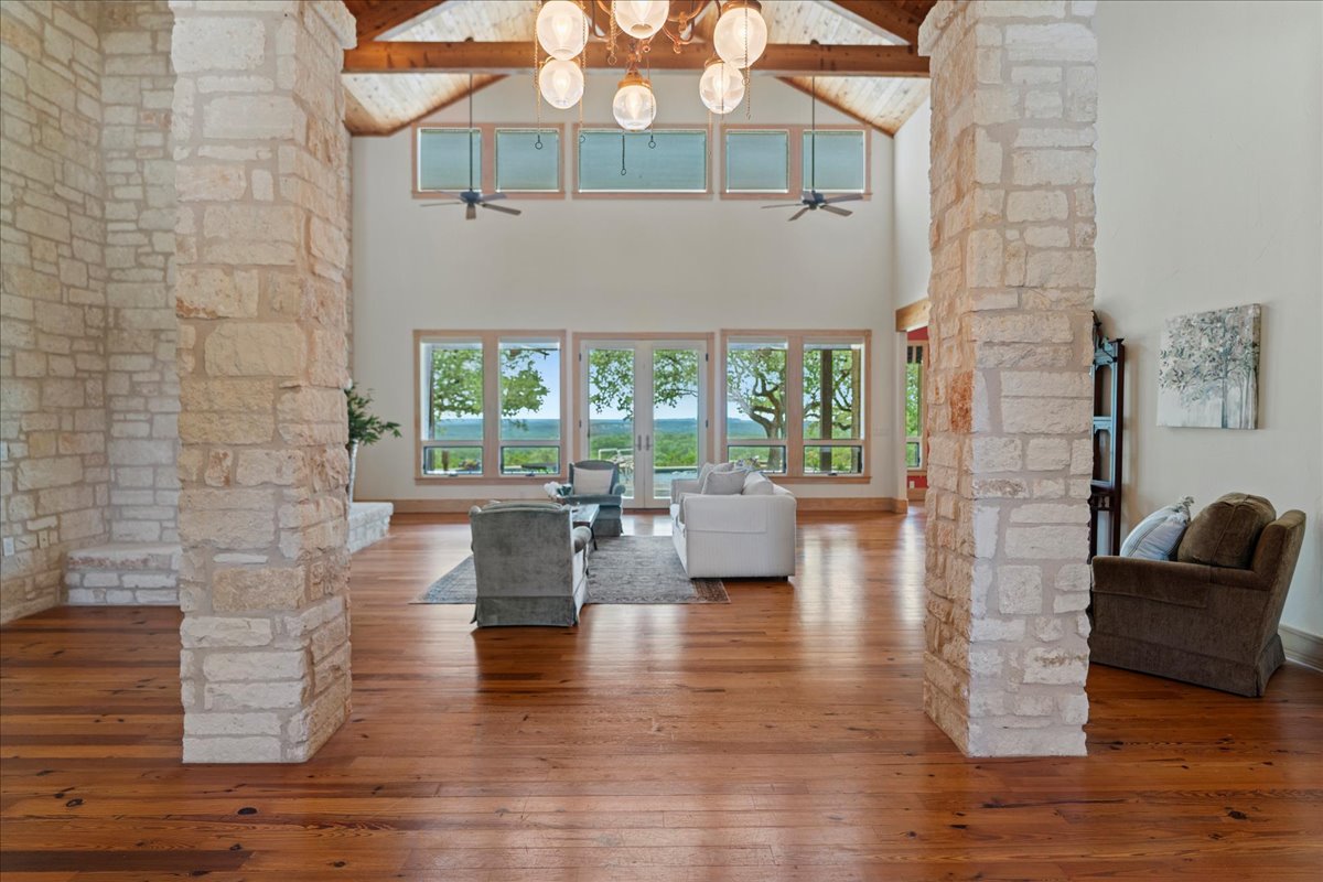 167 Wimberley Ranch Drive Wimberley, TX 78676 - Photo 7 of 40 a living room with furniture and a large window