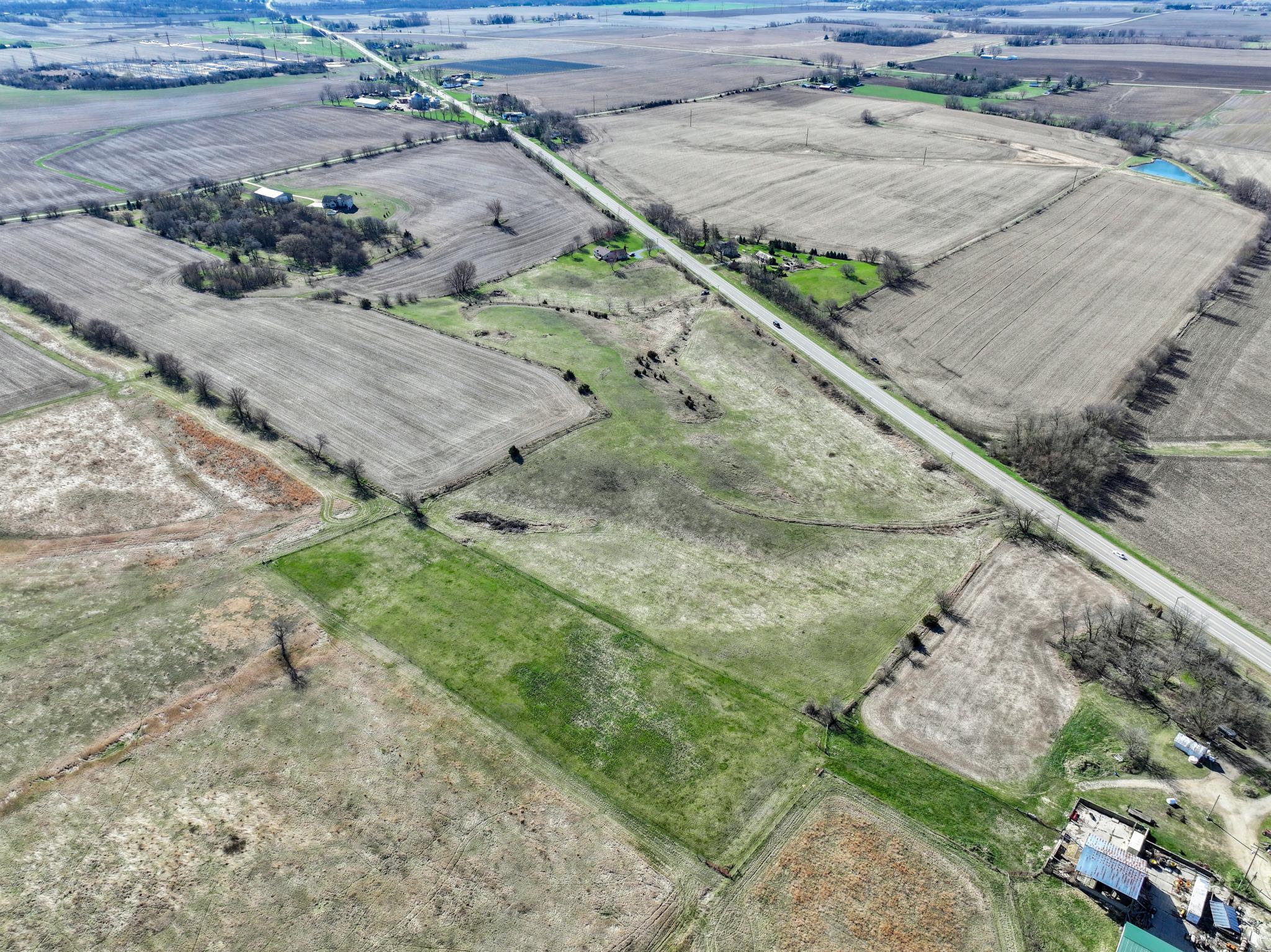 88-xx 88-xx Trask Bridge Road Rockton, IL 61072 - Photo 1 of 39 a view of a backyard with wooden fence