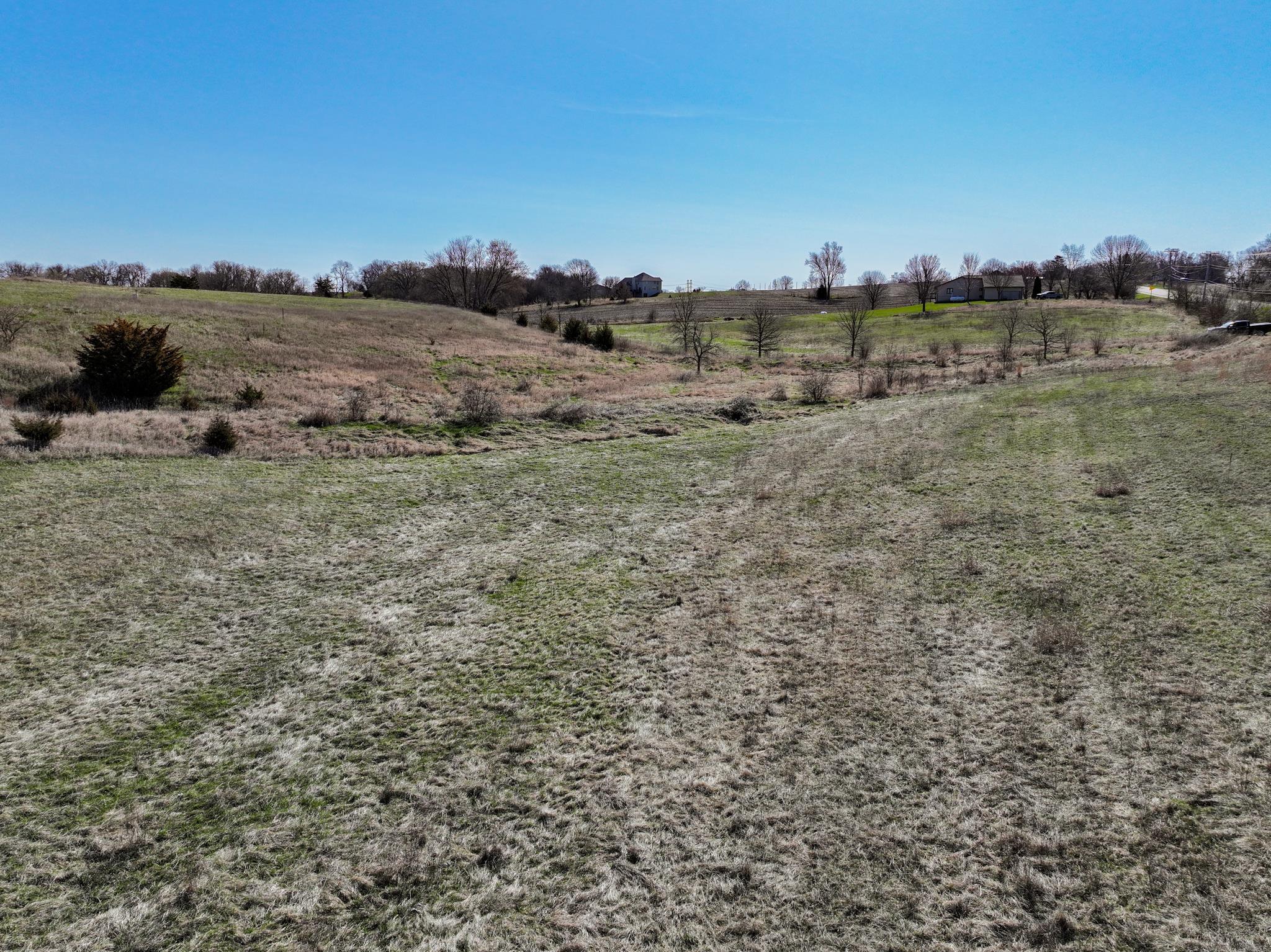88-xx 88-xx Trask Bridge Road Rockton, IL 61072 - Photo 17 of 39 a view of a dry yard with trees