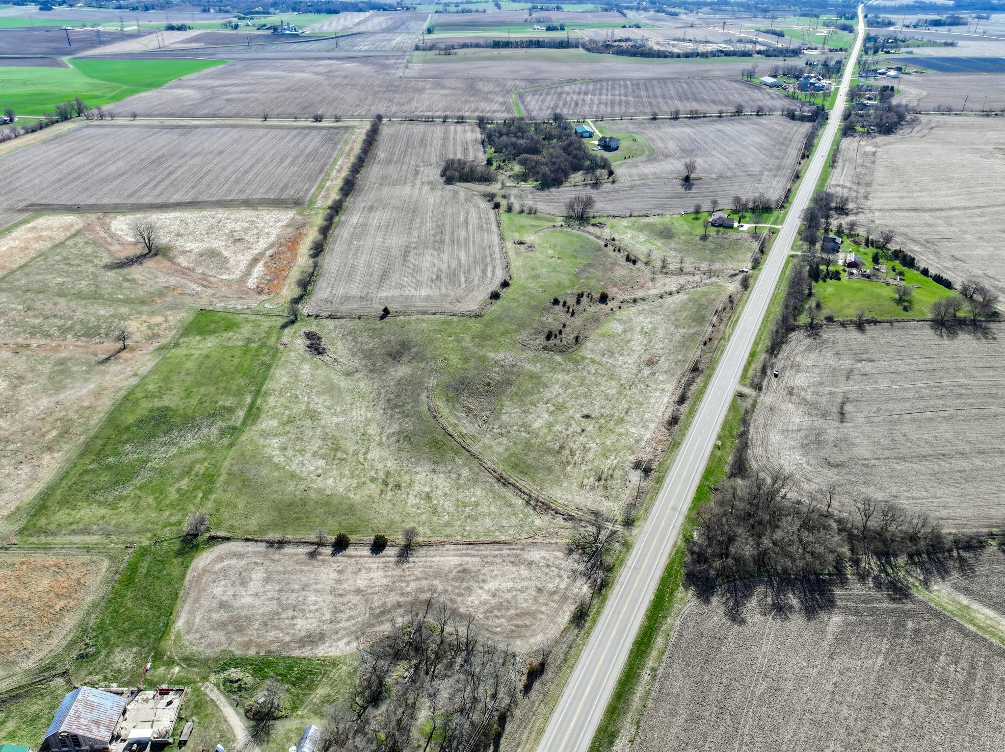 88-xx 88-xx Trask Bridge Road Rockton, IL 61072 - Photo 2 of 39 a view of a yard with a wooden fence