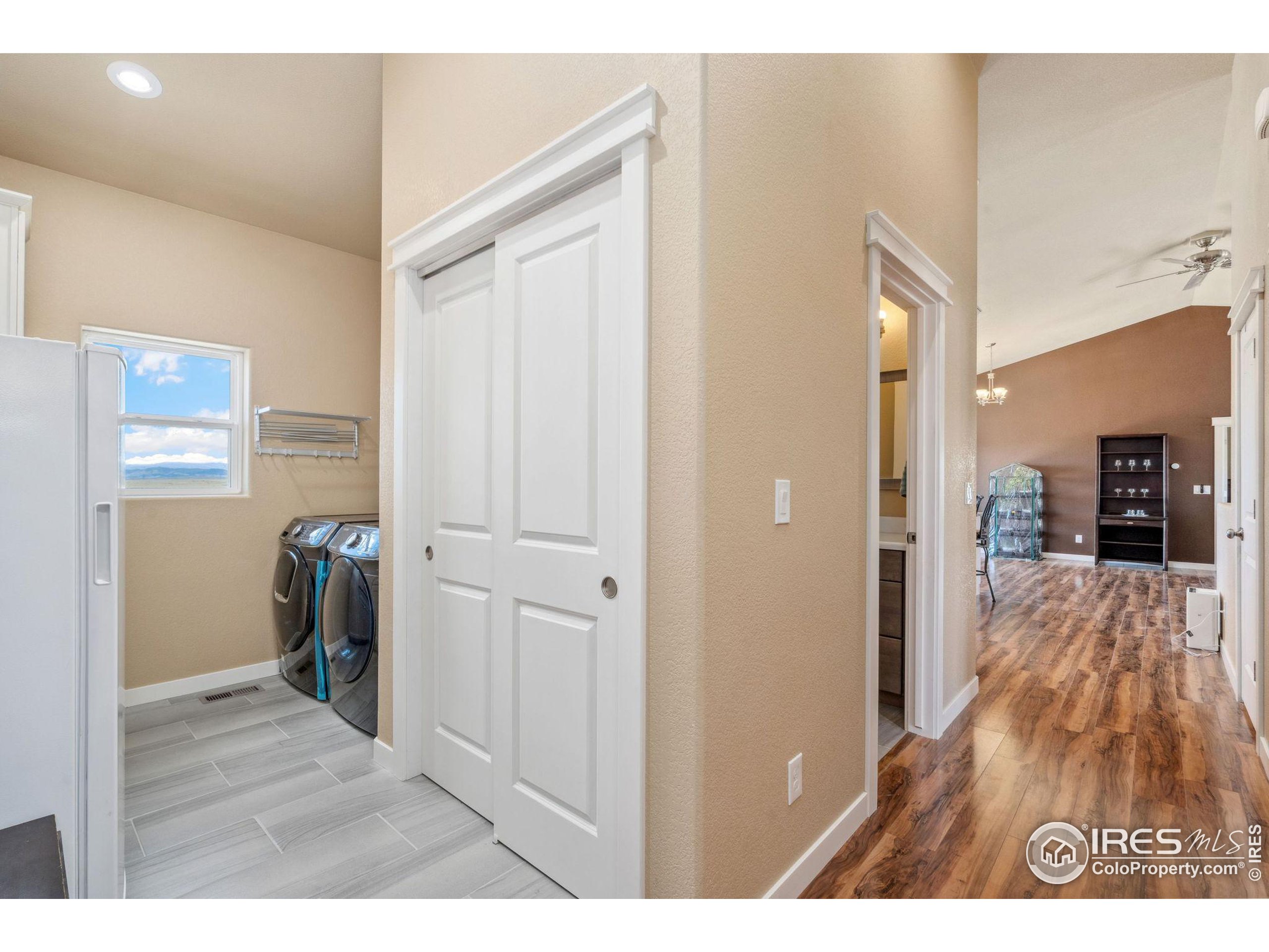 19672 Rawhide Flats Road Wellington, CO 80549 - Photo 22 of 35 a view of hallway with wooden floor