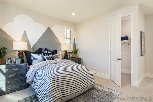 a bed room with a bed and a large mirror