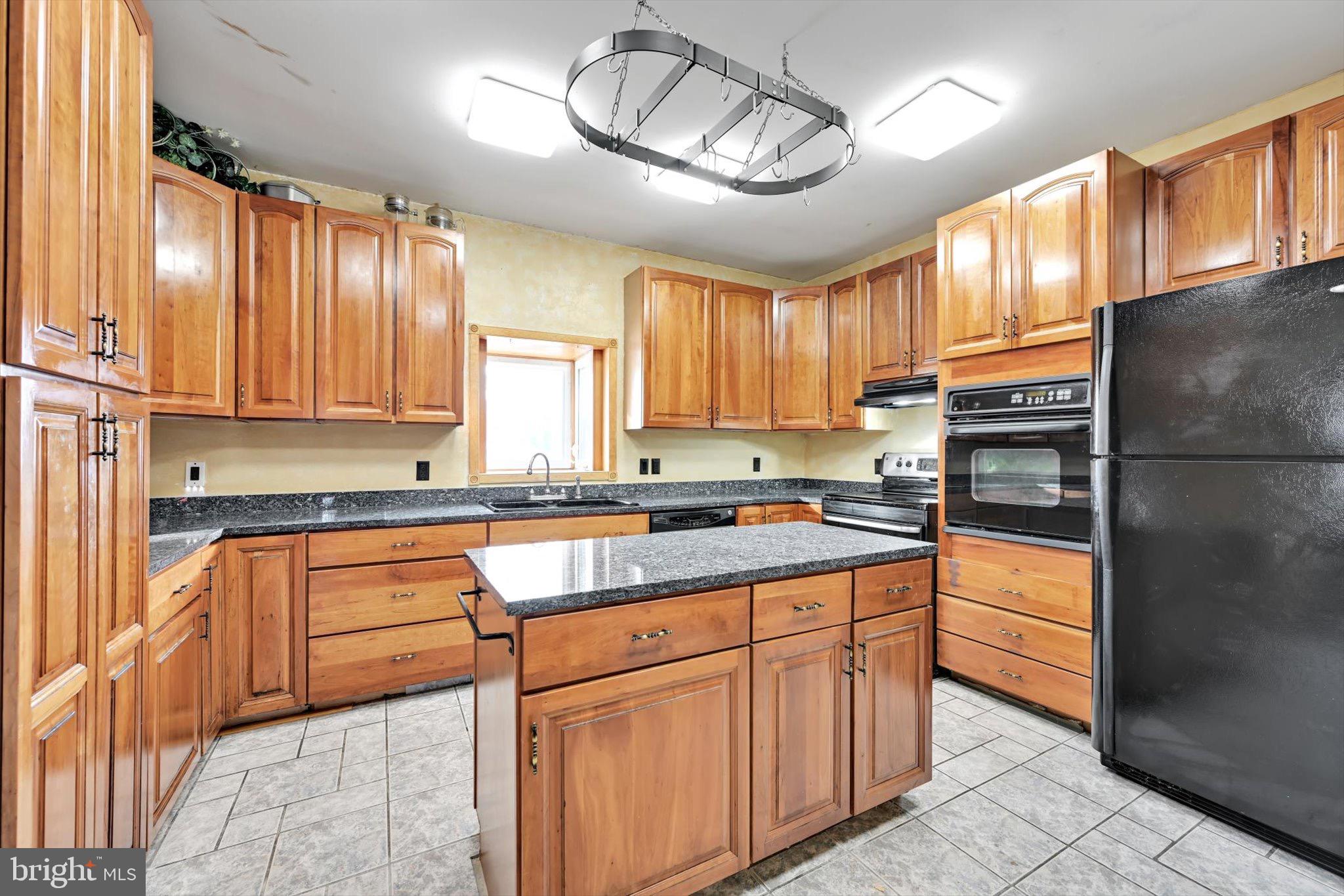 268 West Main Street Ringtown, PA 17967 - Photo 7 of 24 a kitchen with stainless steel appliances granite countertop a refrigerator a stove a sink and a microwave