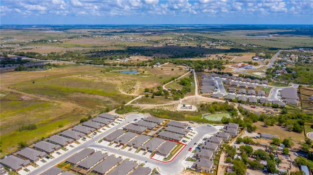 153 Samuel Drive, Unit B Buda, TX 78610 - Photo 24 of 28 a view of a city with an ocean
