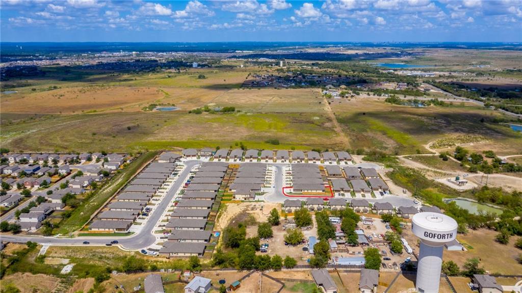 153 Samuel Drive, Unit B Buda, TX 78610 - Photo 25 of 28 a view of an ocean with city