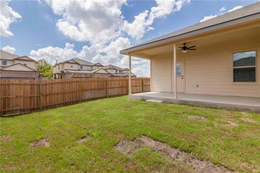 153 Samuel Drive, Unit B Buda, TX 78610 - Photo 27 of 28 a view of a backyard