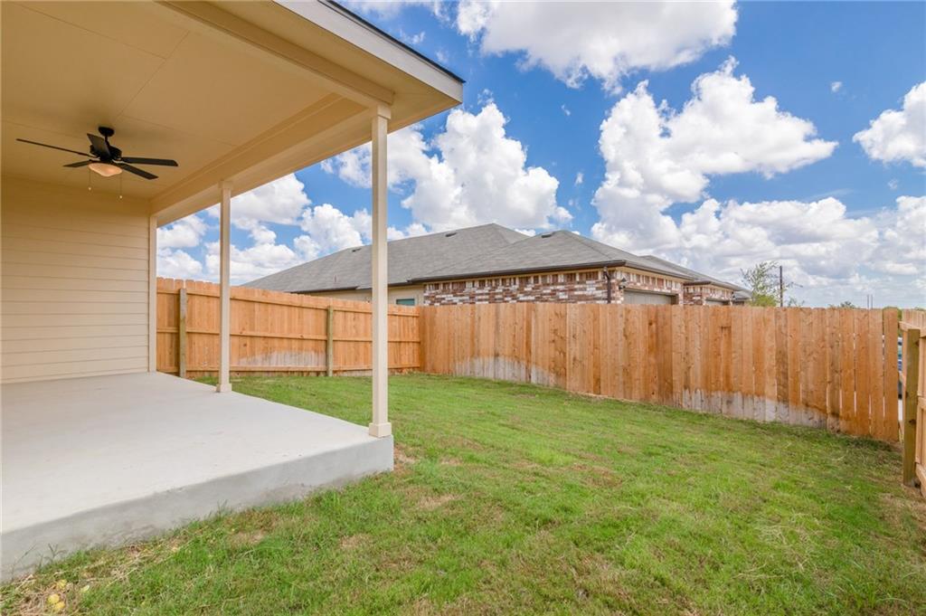 153 Samuel Drive, Unit B Buda, TX 78610 - Photo 28 of 28 a view of a backyard with a garden