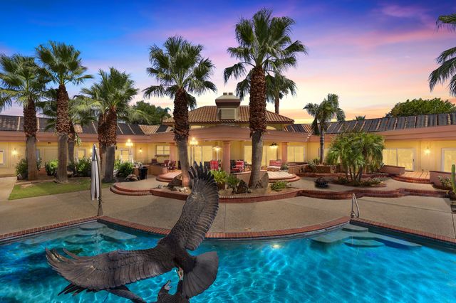 a view of a living room and kitchen