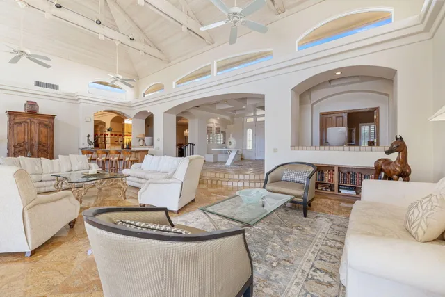 a view of a patio with table and chairs under an umbrella