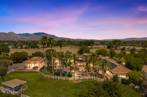 a kitchen with stainless steel appliances granite countertop a stove and a refrigerator