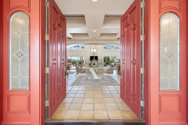 a bathroom with a granite countertop sink a toilet a mirror and shower