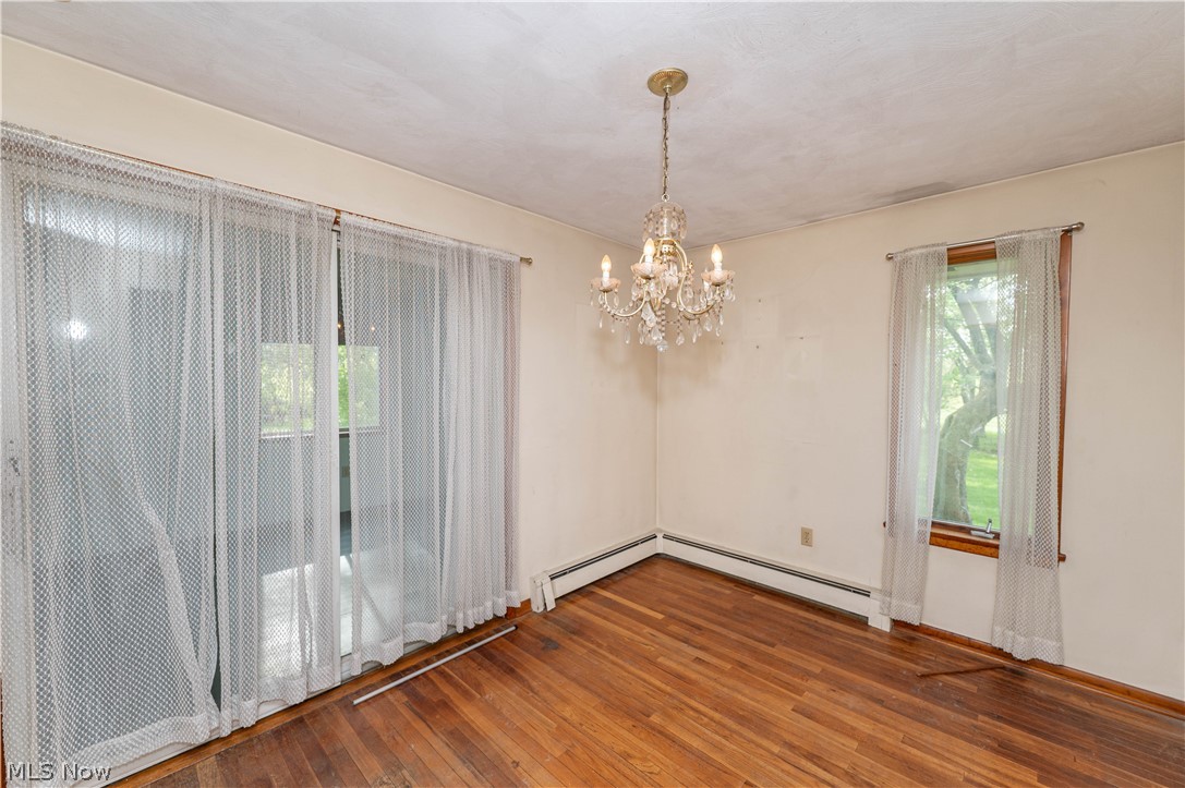 12310 Huntoon Road Painesville, OH 44077 - Photo 10 of 48 Formal dining room opens to the large, comfortable 3-season room