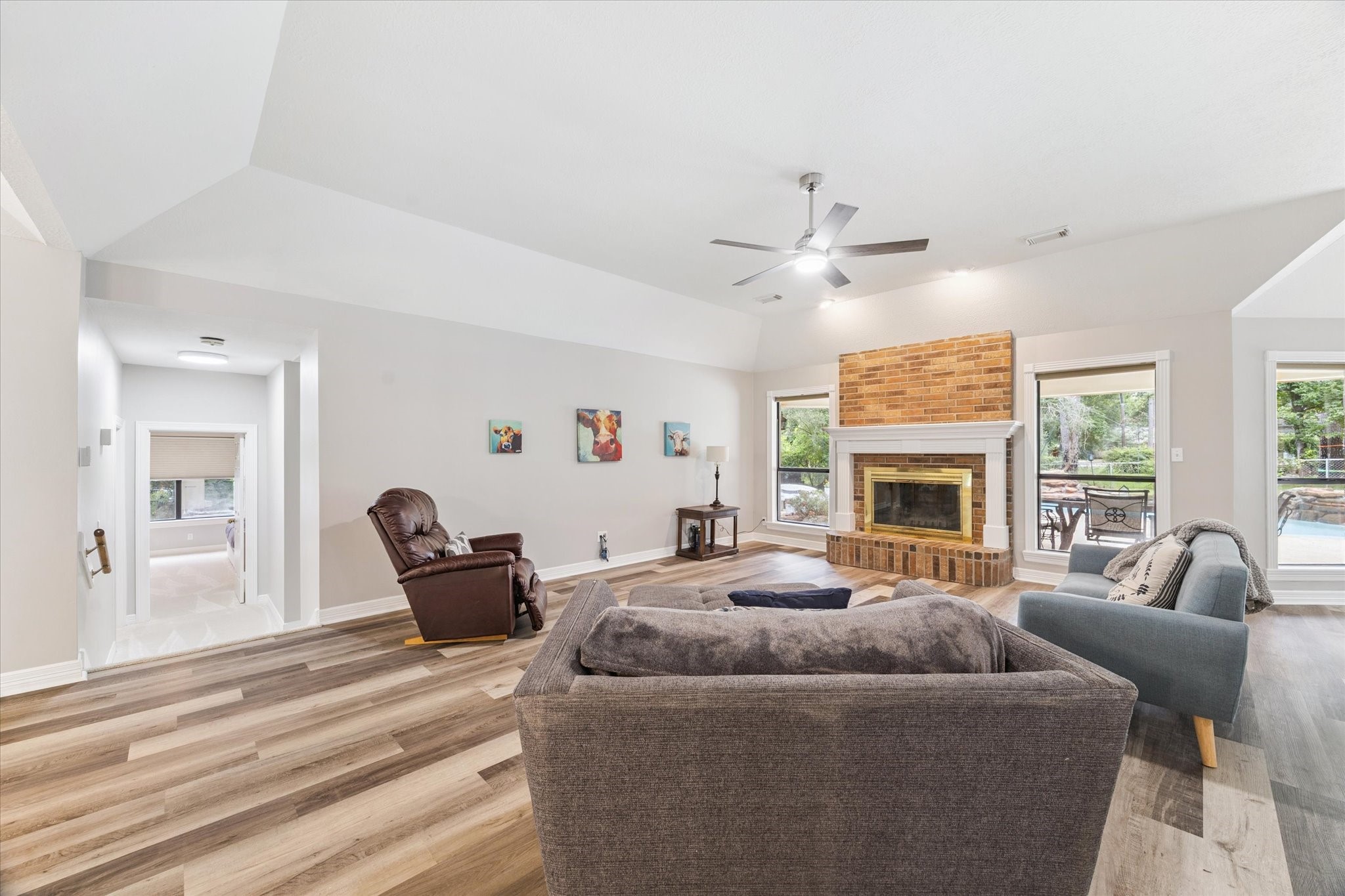 23818 Pin Oak Drive Spring, TX 77389 - Photo 13 of 31 Spacious open-concept layout connects the dining, living, and kitchen areas—ideal for entertaining and modern living.