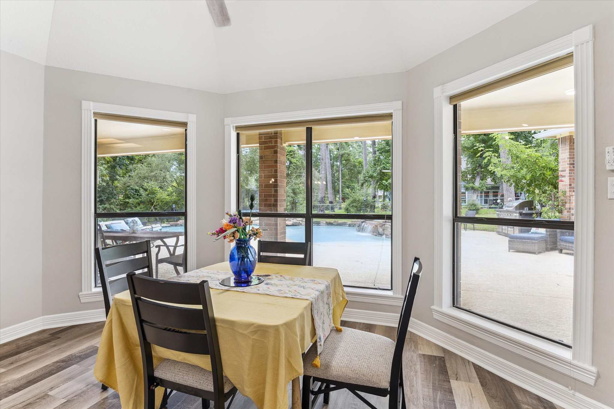 23818 Pin Oak Drive Spring, TX 77389 - Photo 19 of 31 Charming breakfast area with bay windows and backyard views—wake up to peaceful greenery and natural light.