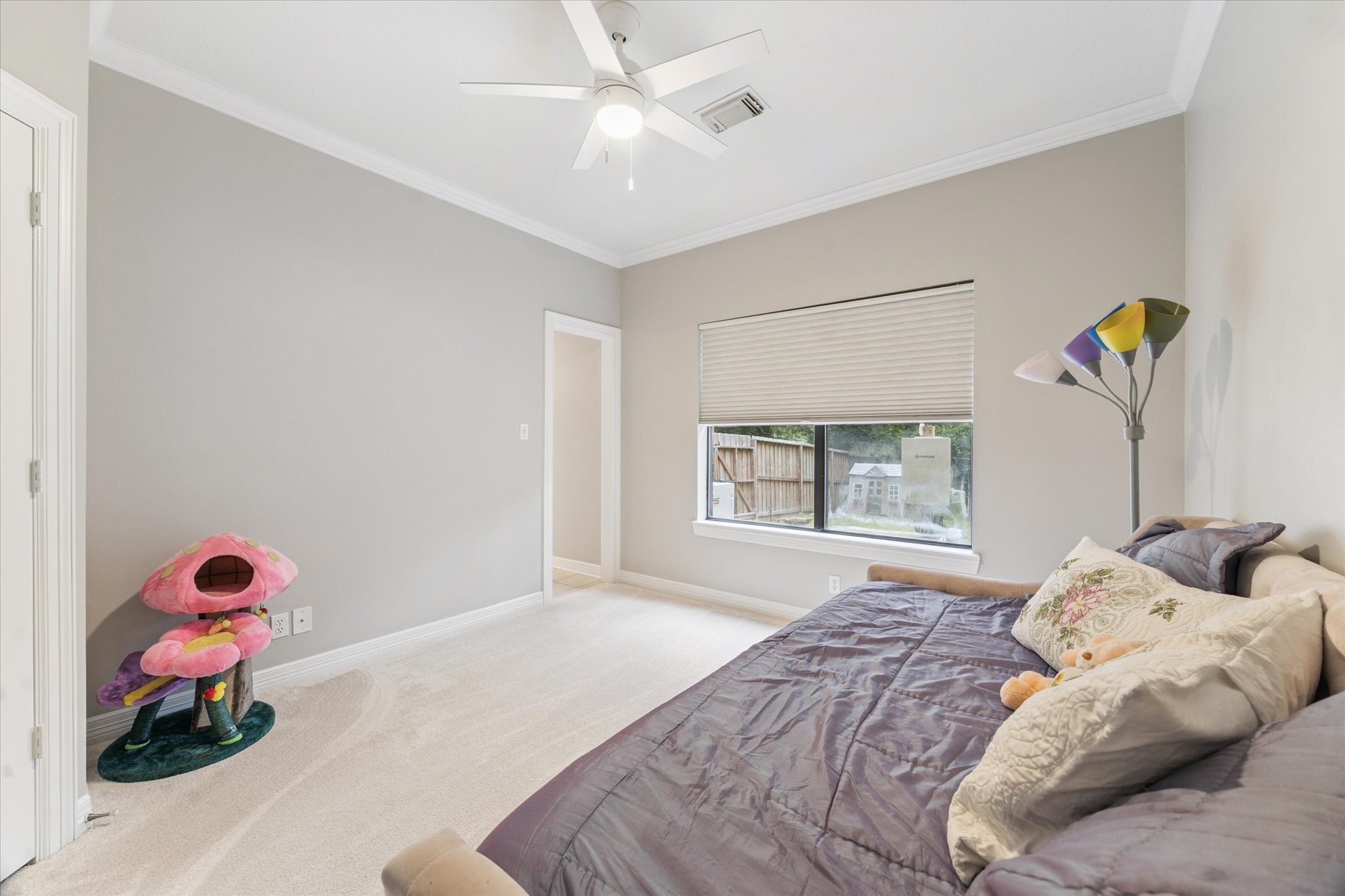 23818 Pin Oak Drive Spring, TX 77389 - Photo 27 of 31 This versatile bedroom overlooks the backyard and features updated ceiling fan and a quiet, cozy atmosphere.