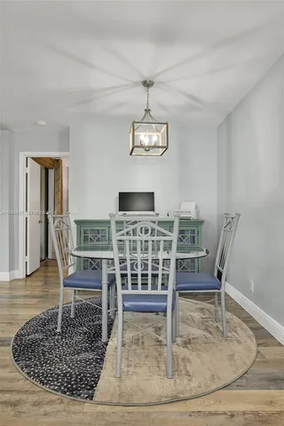 a view of a livingroom with furniture and wooden floor