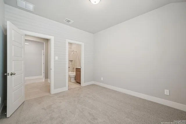 an empty room with closet area