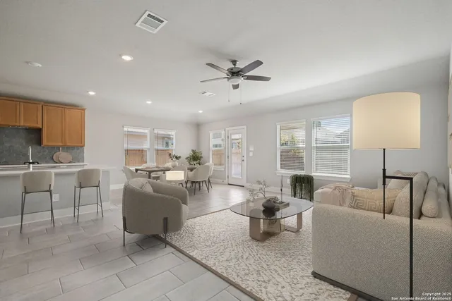 a living room with furniture and a large window
