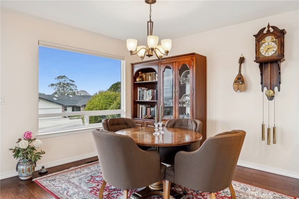 280 Kern Avenue Morro Bay, CA 93442 - Photo 18 of 54 a dining room with furniture a chandelier and window