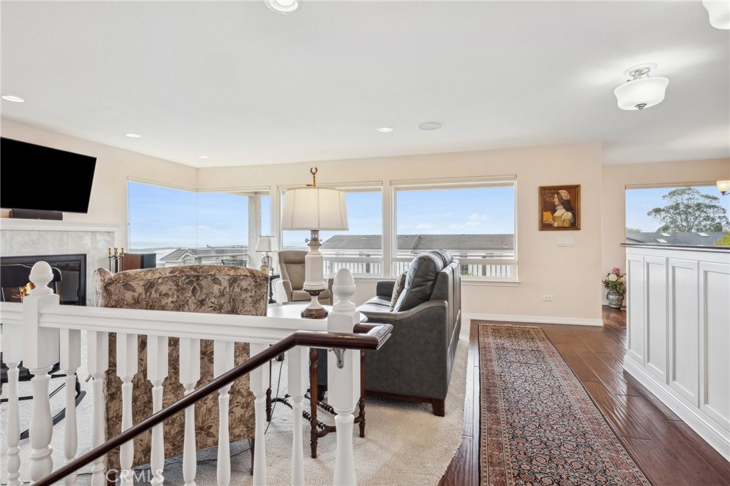 280 Kern Avenue Morro Bay, CA 93442 - Photo 20 of 54 a view of a living room a dining room with furniture window and wooden floor