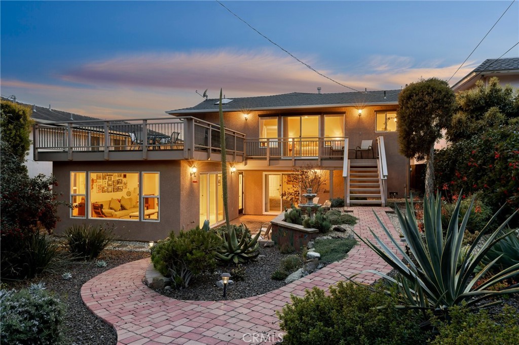 280 Kern Avenue Morro Bay, CA 93442 - Photo 2 of 54 a front view of a house with a garden