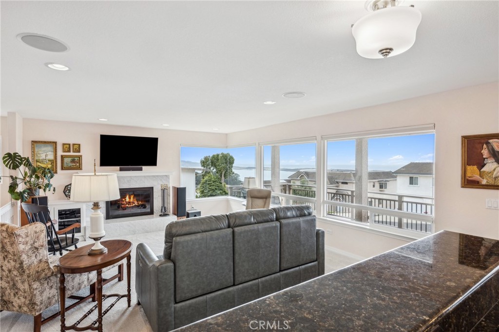 280 Kern Avenue Morro Bay, CA 93442 - Photo 24 of 54 a living room with fireplace furniture and a flat screen tv