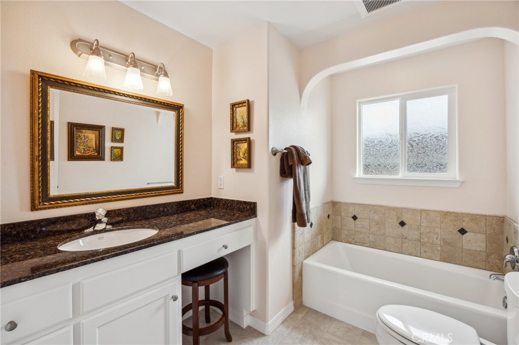 280 Kern Avenue Morro Bay, CA 93442 - Photo 25 of 54 a bathroom with a granite countertop sink mirror toilet and bathtub
