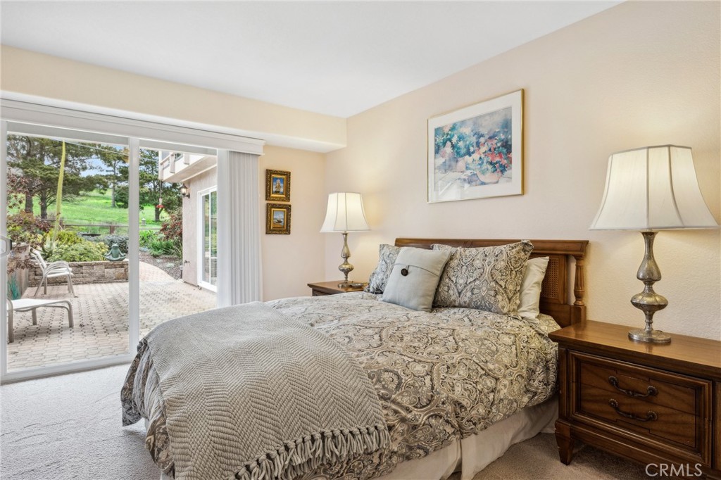 280 Kern Avenue Morro Bay, CA 93442 - Photo 34 of 54 a bedroom with a bed and a lamp