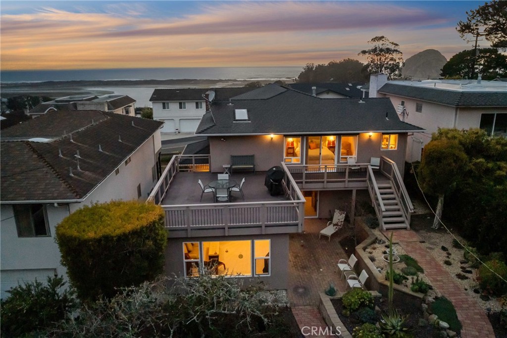 280 Kern Avenue Morro Bay, CA 93442 - Photo 52 of 54 a view of a balcony with two chairs and a grill