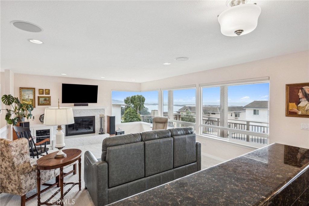 280 Kern Avenue Morro Bay, CA 93442 - Photo 10 of 54 a living room with fireplace furniture and a flat screen tv
