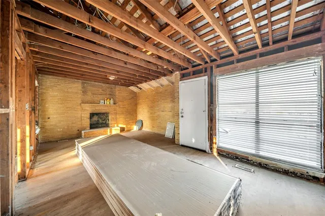 a view of an empty room with wooden walls