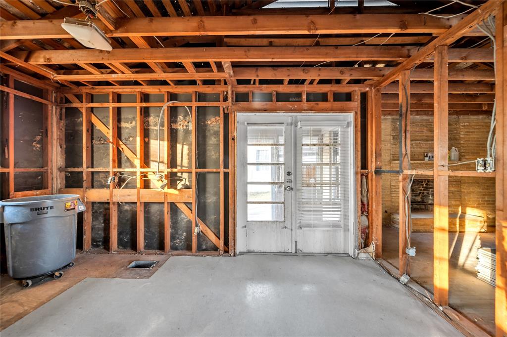 1026 Ridge Road Rockwall, TX 75087 - Photo 14 of 15 a view of an empty room with wooden floor and windows