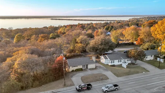 an aerial view of residential houses with outdoor space