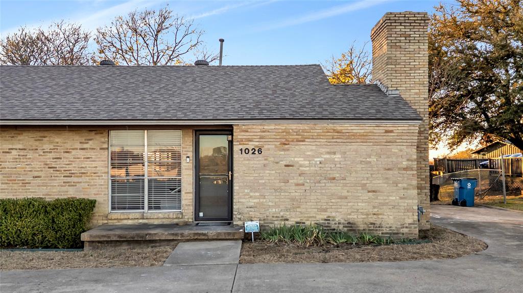 1026 Ridge Road Rockwall, TX 75087 - Photo 9 of 15 a brick house with a large windows