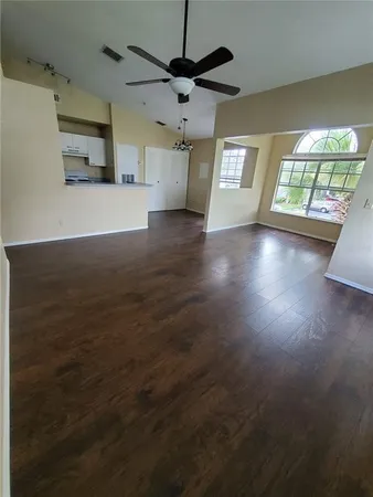 a view of an empty room with a window