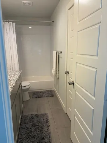 a kitchen with a sink a counter top space stainless steel appliances and cabinets